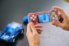 Load image into Gallery viewer, Hands holding a transparent electronic device with a screen displaying a blue sphere, next to a small blue toy car on a dark surface.