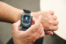 Load image into Gallery viewer, Person wearing a futuristic smartwatch with a unique design on their wrist.
