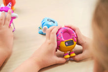 Load image into Gallery viewer, Child holding a colorful toy with sprinkles on a light surface