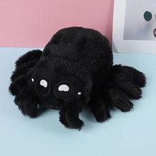 Load image into Gallery viewer, Kumoko Black plush spider toy on a light blue surface with a pink background