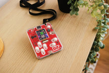 Load image into Gallery viewer, Red electronic badge with 'BIT' logo on a wooden surface
