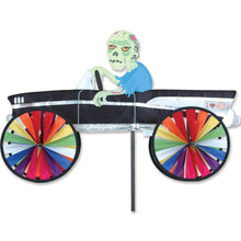 Load image into Gallery viewer, Decorative Halloween Zombie driving a car with spinning wheels  on a white background
