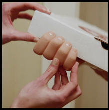 Load image into Gallery viewer, Front view of Secret Hand holding a box
