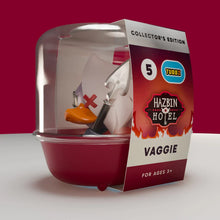 Load image into Gallery viewer, Close up view of Hazbin Hotel Vaggie TUBBZ rubber duck figurine in packaging holding a spear on a pink background
