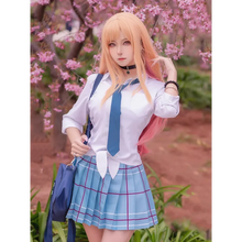 Load image into Gallery viewer, Person in a Japanese school uniform with pink hair standing in front of cherry blossom trees.
